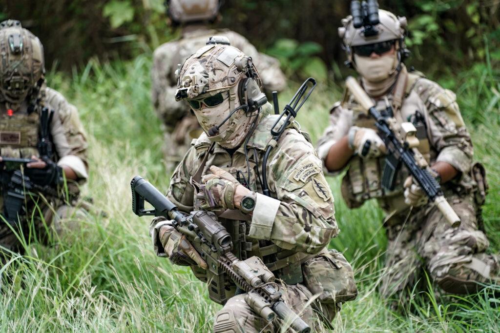 Infantry soldier shooting during military combat training.